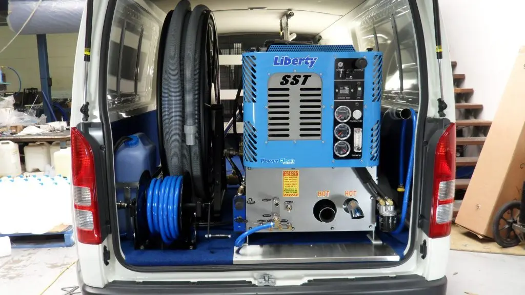 Truck mounted carpet cleaning vacuum system.