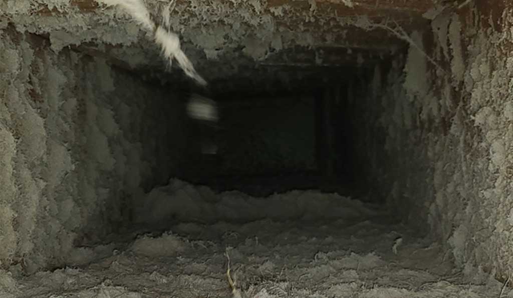 Inside a return air duct near Hales Corners, Wisconsin. It's really dirty and filled with pet dander and hair.