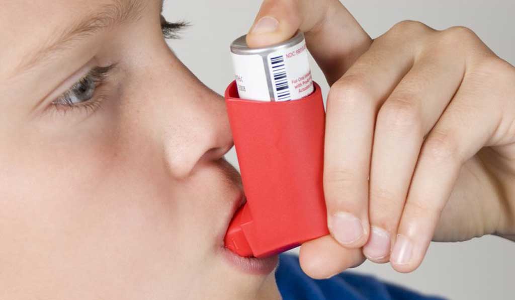 Child using inhaler because of dust issues.
