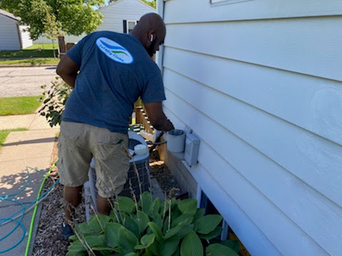 professional dryer duct cleaning technician clearing a lint build up.