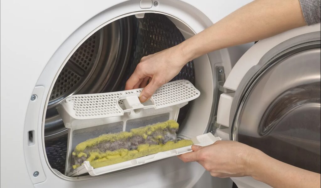 Dryer appliance lint trap filled with lint.