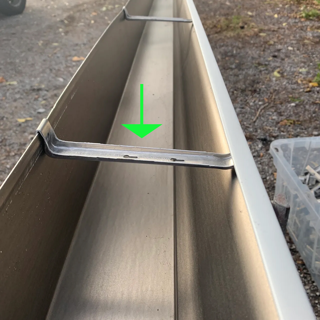 Gutter hangers inside a seamless gutter. 