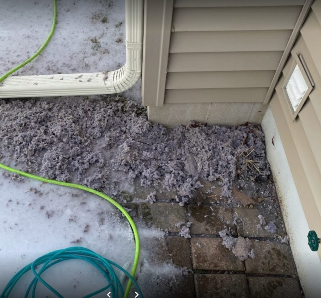 dryer vent unclogged with lint all over outside of home in racine.